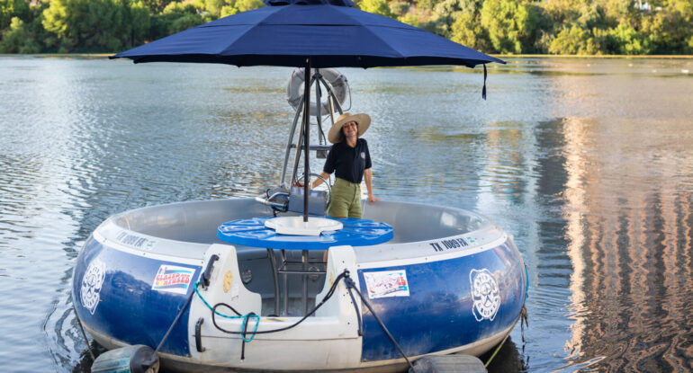 Donut-style electric boat on Lady Bird Lake in Austin