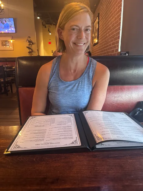 Jen with the menu at Tutta Bella on Cypress Creek